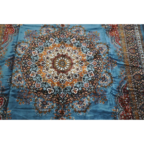 1345 - A LARGE RECTANGULAR BLUE AND RED WOOLEN TUNISIAN RUG, with repeating patterns and multi-strap border... 