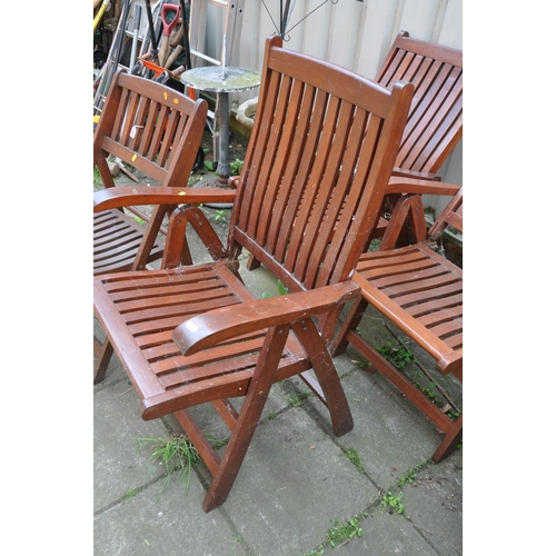 1010 - A SET OF THREE FOLDING HARDWOOD GARDEN CARVER CHAIRS and a similar folding chair (4)