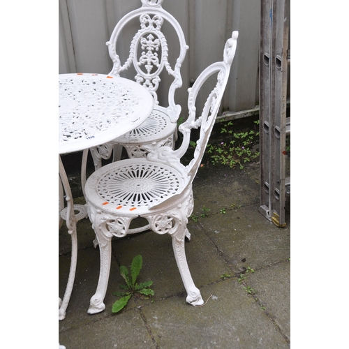 1021 - A WHITE PAINTED CAST ALUMINIUM GARDEN TABLE with a pierced fretwork circular top 68cm in diameter, a... 