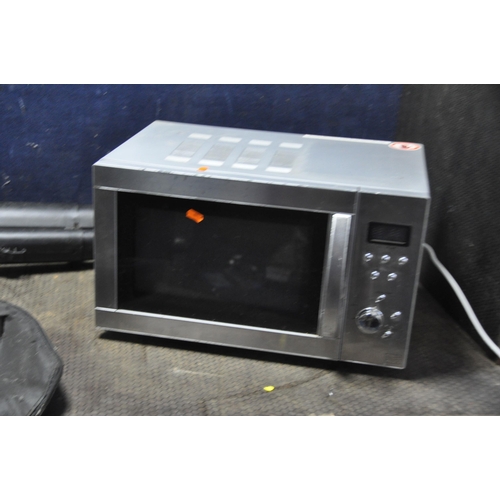 1056 - A TESCO MICROWAVE, a 'The Handy' garden blower vac (collection bag decayed and incomplete) (both PAT... 