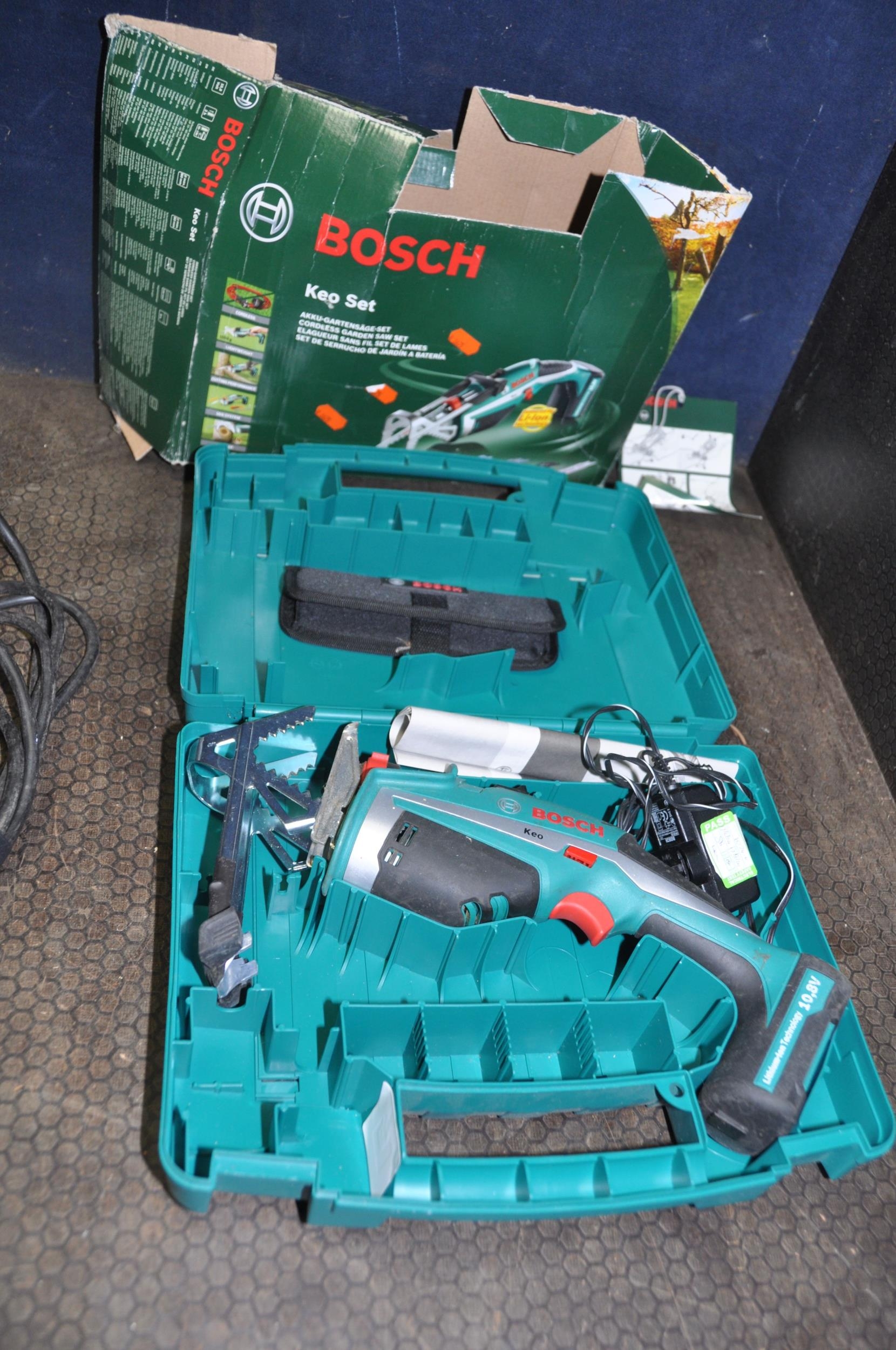 a-collection-of-power-tools-including-a-bosch-keo-cordless-saw-a-black