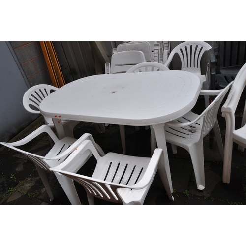 1026 - A LARGE COLLECTION OF PLASTIC GARDEN FURNITURE including a rectangular table 138cm long, two pairs o... 