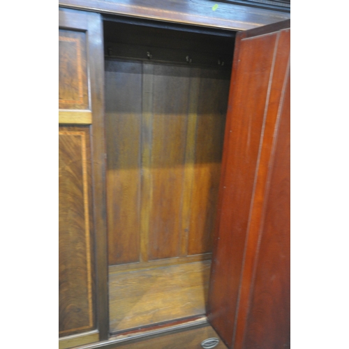 1207 - AN EDWARDIAN MAHOGANY TWO PIECE BEDROOM SUITE, comprising a wardrobe, with a single bevelled mirror ... 