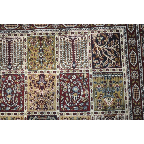 1210 - A LARGE RECTANGULAR VALBY RUTA RUG, with forty-five central decorative squares, surrounded by a mult... 