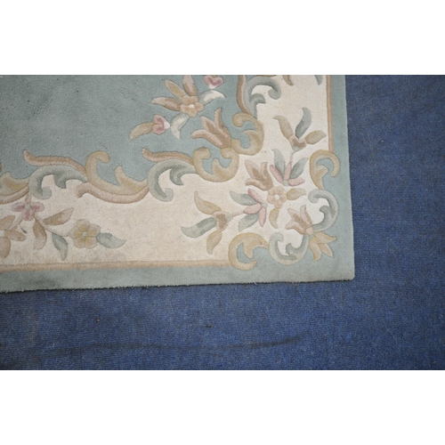 1211 - FIRTH RUGS, A LARGE RECTANGULAR MINT GREEN CHINESE WOOLEN RUG, 274cm x 180cm (condition report: in n... 