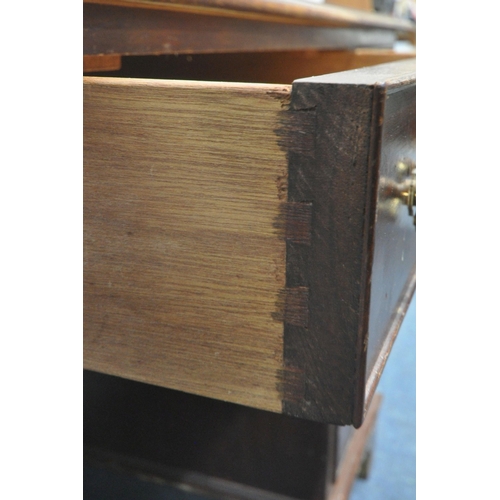 1223 - A 20TH CENTURY MAHOGANY TWIN PEDESTAL DESK, with a green leather writing surface, fitted with eight ... 