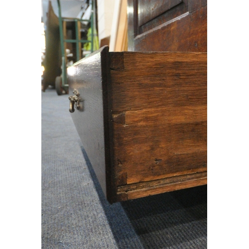 1226 - A GEORGIAN OAK COFFER, with a hinged lid, three front panels, and two drawers, width 136cm x depth 5... 