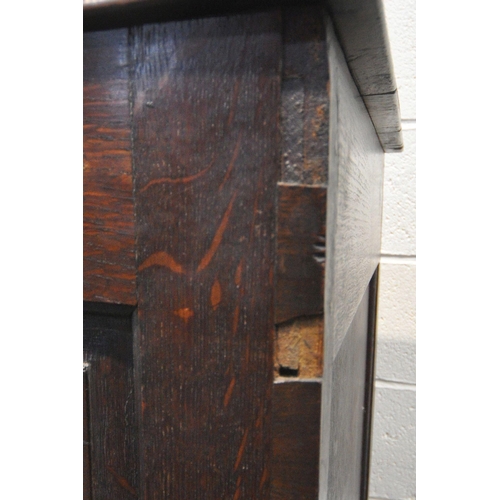 1226 - A GEORGIAN OAK COFFER, with a hinged lid, three front panels, and two drawers, width 136cm x depth 5... 