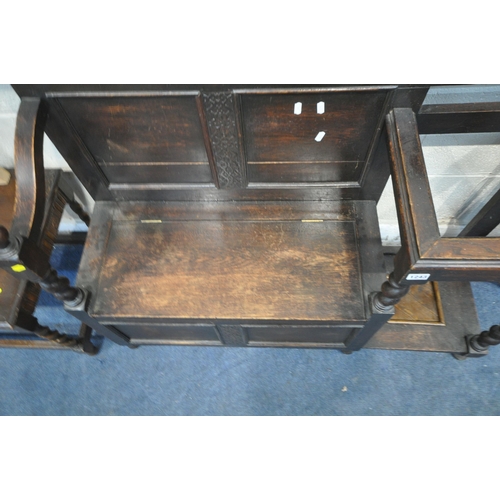 1243 - A 20TH CENTURY OAK TELEPHONE TABLE, with a hinged seat, barley twist support, and drip tray, two wal... 