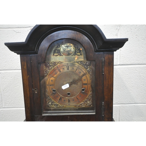 1244 - A 20TH CENTURY OAK GRANDDAUGHTER CLOCK, the arched door enclosing a brass dial, height 170cm (condit... 