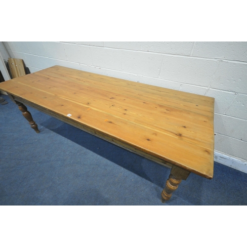 1248 - A 19TH CENURY PINE RECTANGULAR TABLE, raised on turned legs, length 213cm x depth 84cm x height 77cm... 