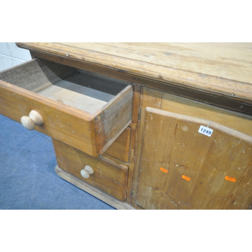 1249 - A 19TH CENTURY PINE SIDEBOARD, fitted with six drawers and a single cupboard door, width 138cm x dep... 