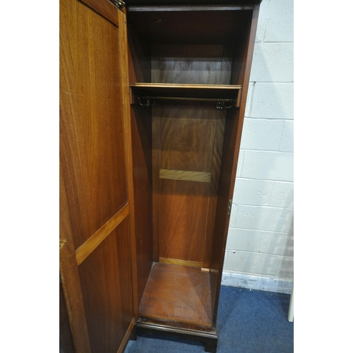 1264 - MAPLE AND CO, AN EDWARDIAN FLAME MAHOGANY COMPACTUM WARDROBE, fitted with two bevelled mirror doors,... 