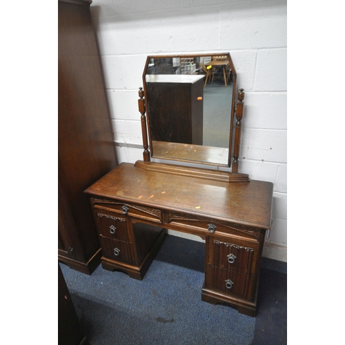 1285 - A 20TH CENTURY OAK FOUR PIECE BEDROOM SUITE, comprising a double door wardrobe, width 130cm x depth ... 