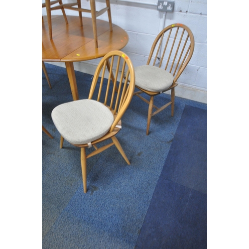 1295 - LUCIAN ERCOLANI, A MID CENTURY ELM AND BEECH DROP LEAF DINING TABLE, raised on splayed square tapere... 