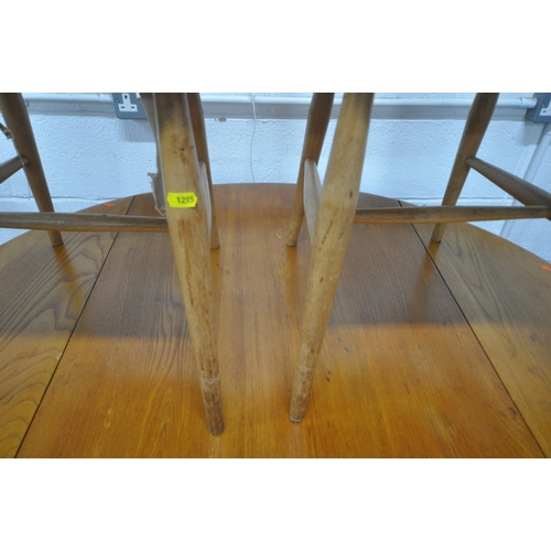 1295 - LUCIAN ERCOLANI, A MID CENTURY ELM AND BEECH DROP LEAF DINING TABLE, raised on splayed square tapere... 