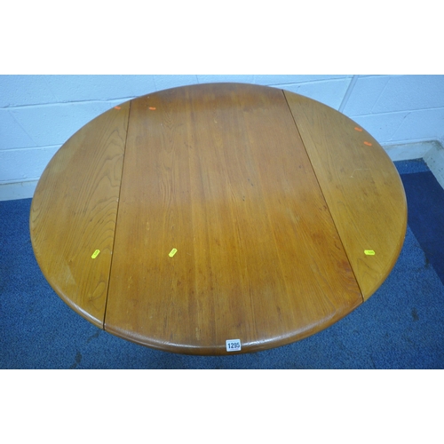 1295 - LUCIAN ERCOLANI, A MID CENTURY ELM AND BEECH DROP LEAF DINING TABLE, raised on splayed square tapere... 