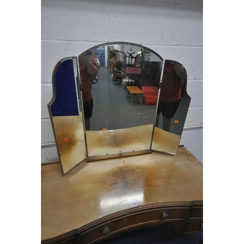 1301 - A 20TH CENTURY WALNUT DRESSING TABLE, with a triple mirror, five assorted drawers, raised on cabriol... 