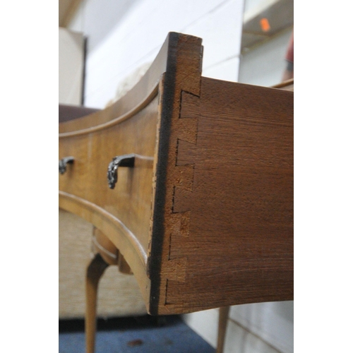 1301 - A 20TH CENTURY WALNUT DRESSING TABLE, with a triple mirror, five assorted drawers, raised on cabriol... 