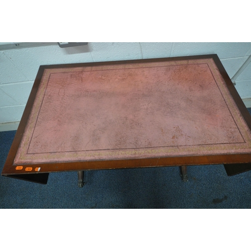 1304 - AN EDWARDIAN MAHOGANY DROP LEAF SOFA TABLE, with pink leather writing surface, two frieze drawers, r... 