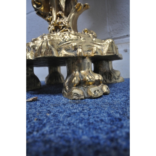 1306 - A GILT RESIN MARBLE TOP CONSOLE TABLE, in the form of a boy in robes, with foliate details, raised o... 