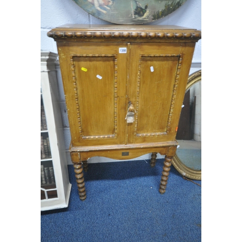 1308 - A 19TH CENTURY DOUBLE DOOR CABINET, raised on bobbin turned legs, width 66cm x depth 33cm x height 1... 