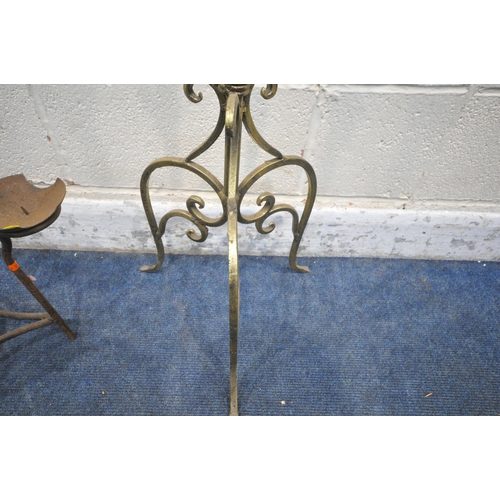 1328 - A WROUGHT IRON NINE BRANCH CANDELABRA, raised on three legs, height 144cm, along with a small three ... 