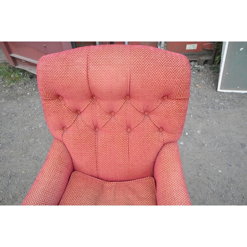 1333 - A VICTORIAN DEEP ARMCHAIR, with red and gold patterned upholstery, raised on turned front legs and c... 