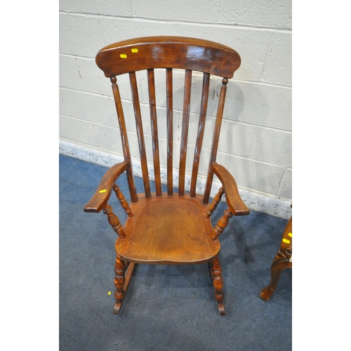 1351 - A REPRODUCTION VICTORIAN STYLE ARMCHAIR, with shaped crest, and open armrests, along with a rocking ... 