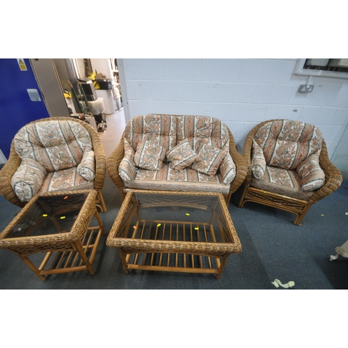 1356 - A WICKER FIVE PIECE CONSERVATORY SUITE, comprising a two seater sofa, a pair of armchairs, along wit... 