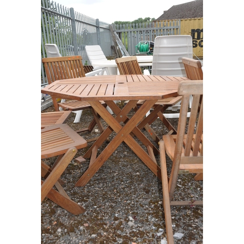 1007 - A MODERN HARDWOOD FOLDING TABLE AND SIX CHAIRS badged FWT to all the octagonal table is 120cm across... 