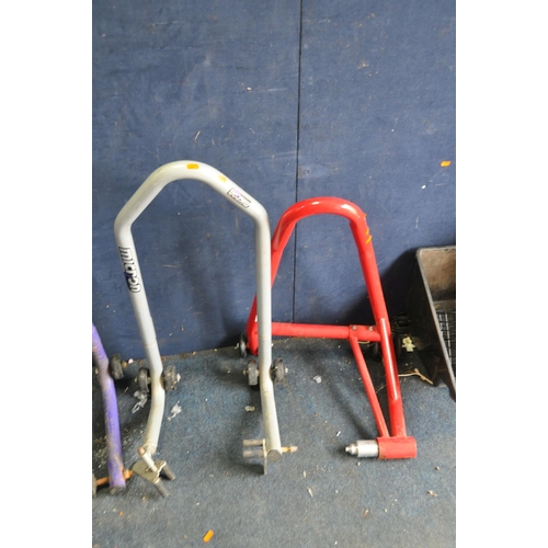 1059 - FOUR MOTORCYCLE PADDOCK STANDS including a front and back wheel by Micron, a frame mount by Bike wor... 