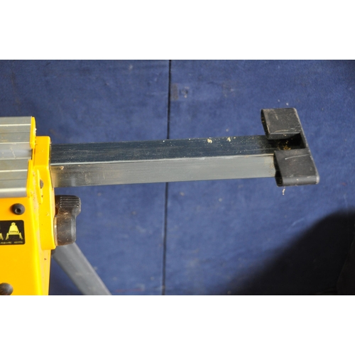 1061 - A DeWALT DE7033 MITRE SAW STAND fitted with two DE7025 supports and a pair of DE7024-XJ