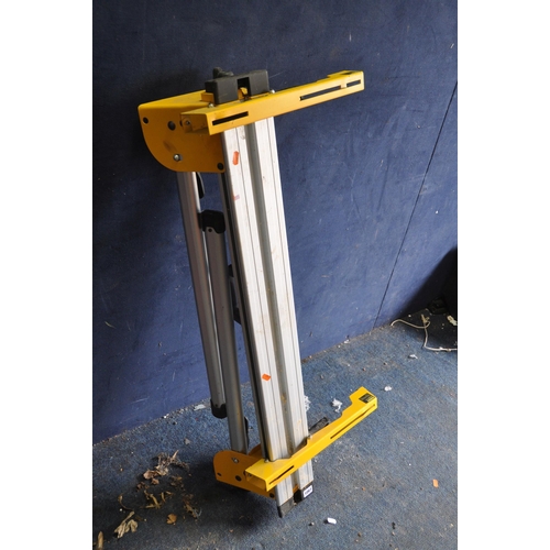 1061 - A DeWALT DE7033 MITRE SAW STAND fitted with two DE7025 supports and a pair of DE7024-XJ