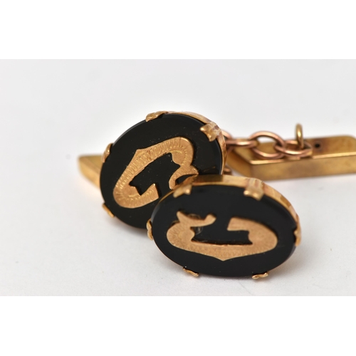 1 - A PAIR OF 9CT GOLD AND ONYX CUFFLINKS, each designed with an oval onyx panel in a double six claw se... 