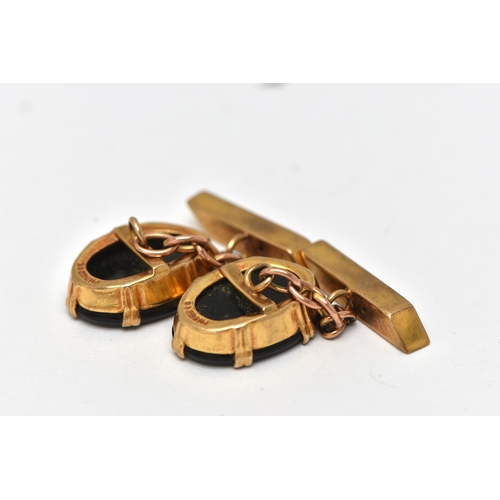 1 - A PAIR OF 9CT GOLD AND ONYX CUFFLINKS, each designed with an oval onyx panel in a double six claw se... 