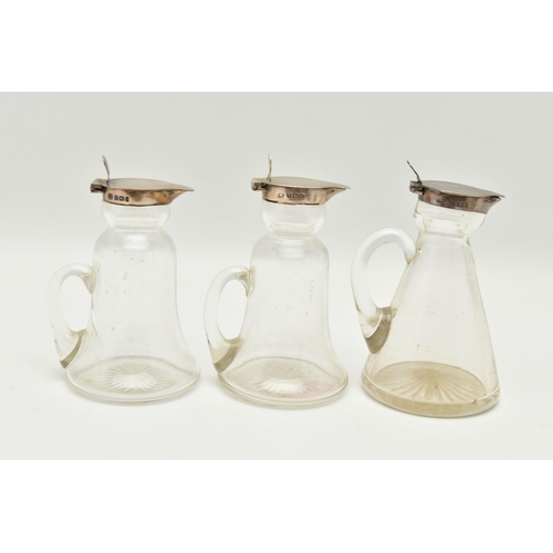 102 - THREE GLASS AND SILVER MOUNTED WHISKEY NOGGINS, glass and silver hinged top whiskey noggins, all thr... 