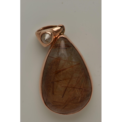 13 - A 9CT GOLD GEM SET PENDANT, a large teardrop rutilated quartz cabochon, collet set in rose gold, app... 