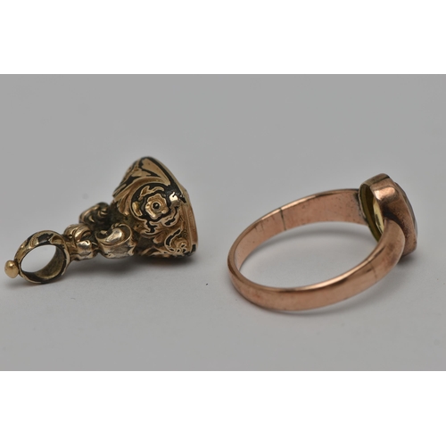 15 - TWO EARLY 20TH CENTURY JEWELLERY ITEMS, the first an oval cut citrine, collet set in rose metal, unm... 