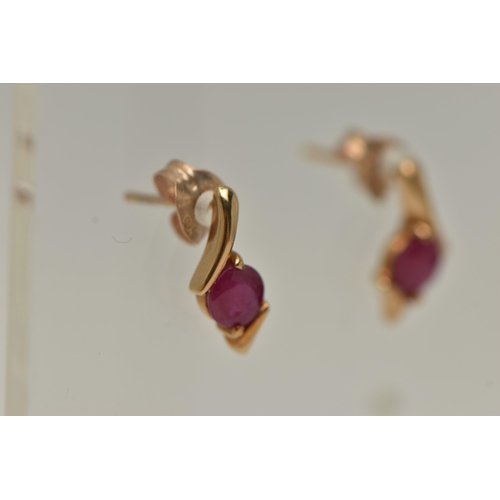 18 - TWO PAIRS OF GEM SET EARRINGS, the first a pair of yellow gold ruby earrings, fitted with post and s... 