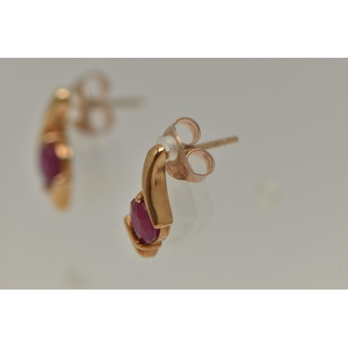 18 - TWO PAIRS OF GEM SET EARRINGS, the first a pair of yellow gold ruby earrings, fitted with post and s... 