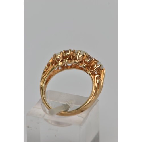 24 - A 9CT GOLD GEM SET RING, three round opals, prong set in yellow gold, accented with one circular cut... 