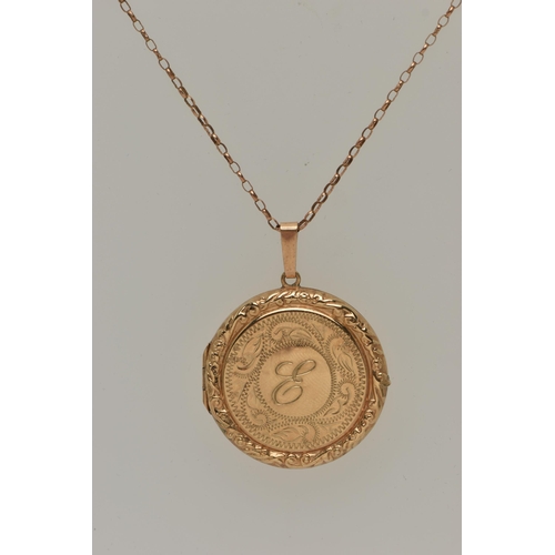 25 - A 9CT GOLD LOCKET PENDANT, a circular form pendant with scrolling detail, letter E engraving to the ... 