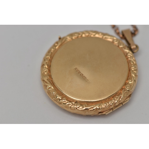 25 - A 9CT GOLD LOCKET PENDANT, a circular form pendant with scrolling detail, letter E engraving to the ... 