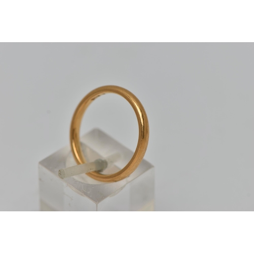 35 - A BAND RING, of plain design, stamped 22ct, ring size N 1/2, approximate weight 4.2 grams (condition... 