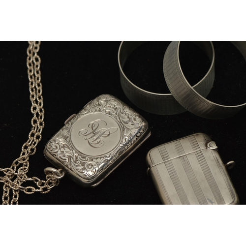 39 - FOUR ITEMS OF SILVER NOVELTIES, to include a coin purse on a modern necklace chain, opening to revea... 