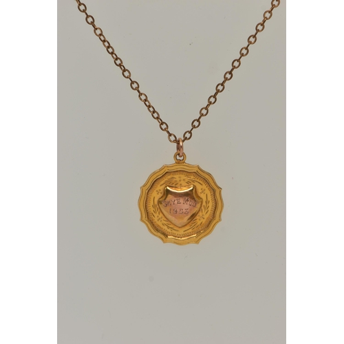 42 - A 9CT GOLD PENDANT WITH A CHAIN, a 9ct gold circular fob pendant with engraved shield cartouche read... 