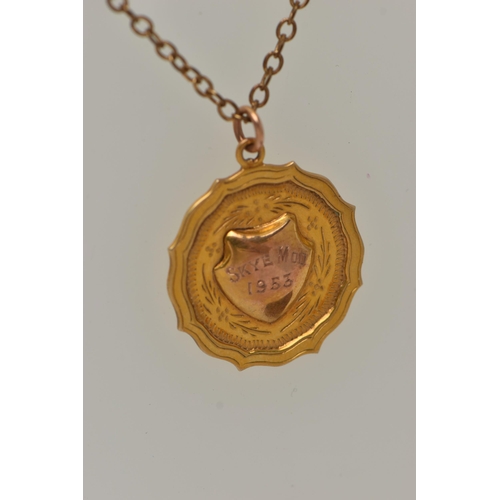 42 - A 9CT GOLD PENDANT WITH A CHAIN, a 9ct gold circular fob pendant with engraved shield cartouche read... 