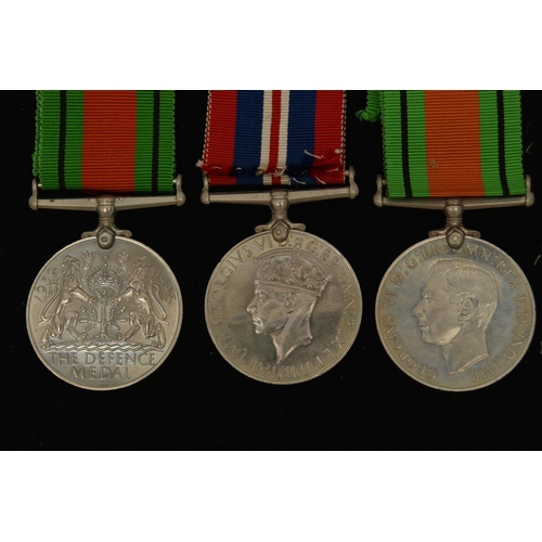 48 - THREE WW2 MEDALS, to include two Defense Medals with ribbons and a 1939-1945 war medal with ribbon