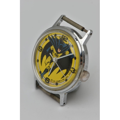 53 - A BATMAN WATCH HEAD, the yellow face with picture of Batman running, stamped DC Comics Inc 1966-1972... 